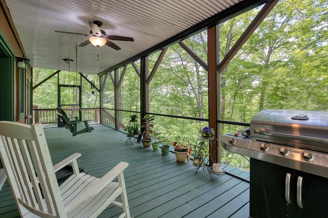 wooden terrace featuring ceiling fan