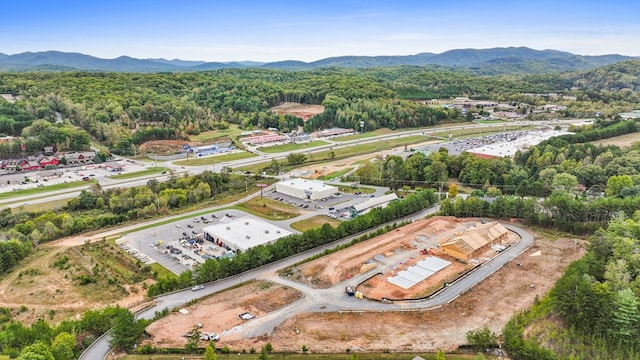 birds eye view of property with a mountain view