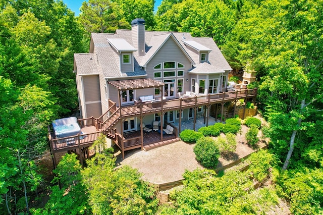 back of house featuring an outdoor living space, a pergola, a patio area, and a deck