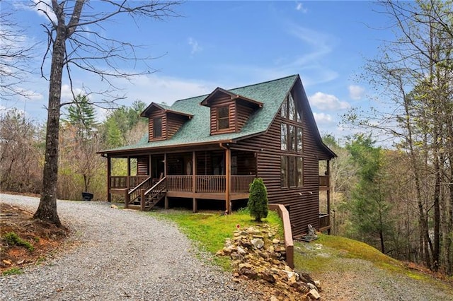 log home with covered porch