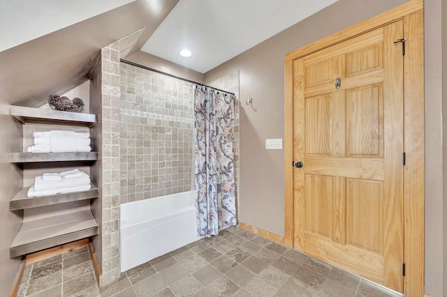 bathroom featuring tile flooring and shower / bathtub combination with curtain