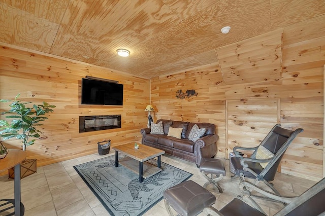 tiled living room featuring wood ceiling and wooden walls