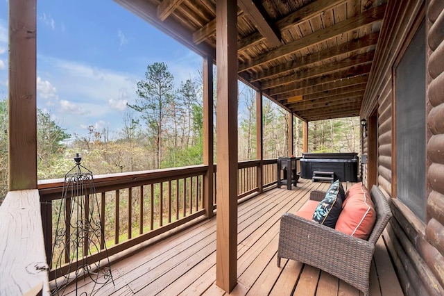 deck with a hot tub