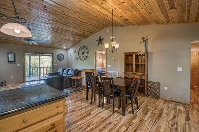 dining space featuring visible vents, ceiling fan with notable chandelier, light wood-type flooring, vaulted ceiling, and wood ceiling