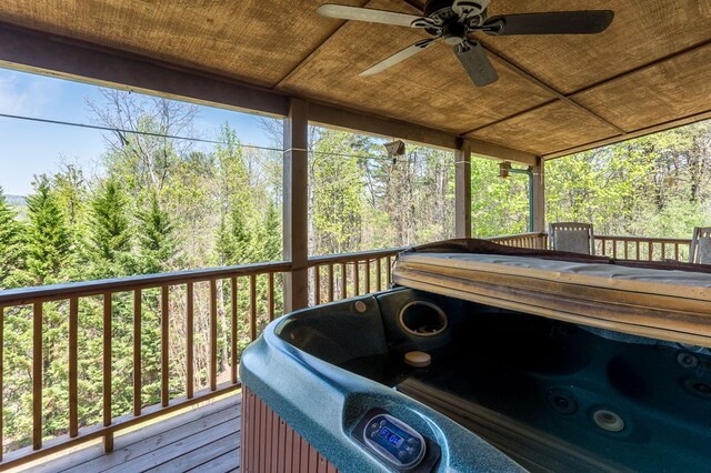 wooden deck with a ceiling fan