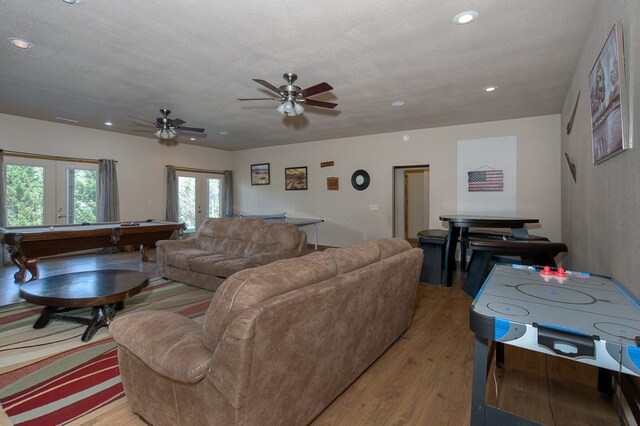 living area featuring billiards, ceiling fan, french doors, light wood finished floors, and recessed lighting