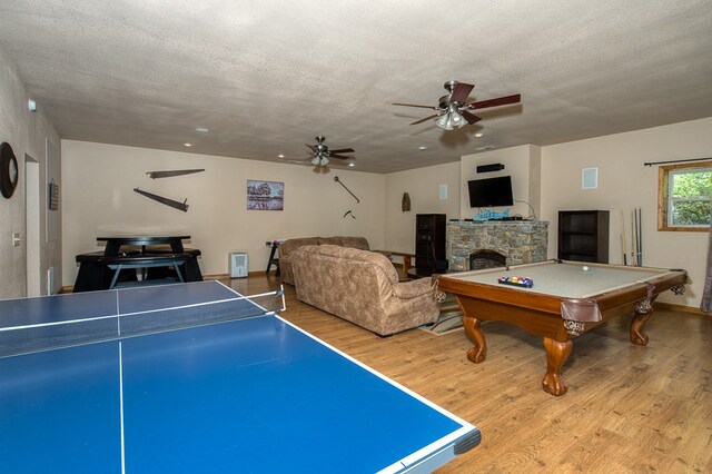 rec room featuring a fireplace, a ceiling fan, billiards, wood finished floors, and visible vents