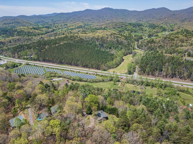 bird's eye view with a forest view and a mountain view
