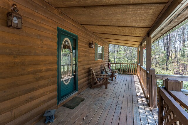 wooden terrace featuring a porch