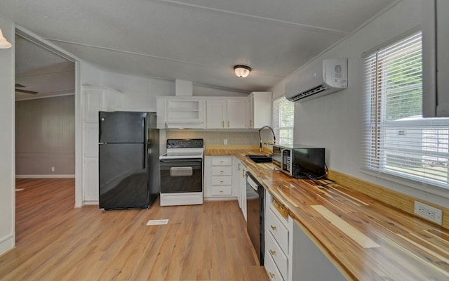 kitchen featuring light wood finished floors, a wall mounted air conditioner, white cabinetry, butcher block counters, and black appliances