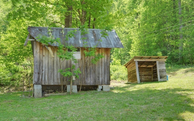 view of shed featuring a wooded view
