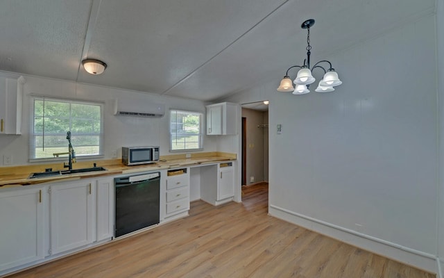 kitchen with a sink, dishwasher, light countertops, stainless steel microwave, and a wall mounted AC