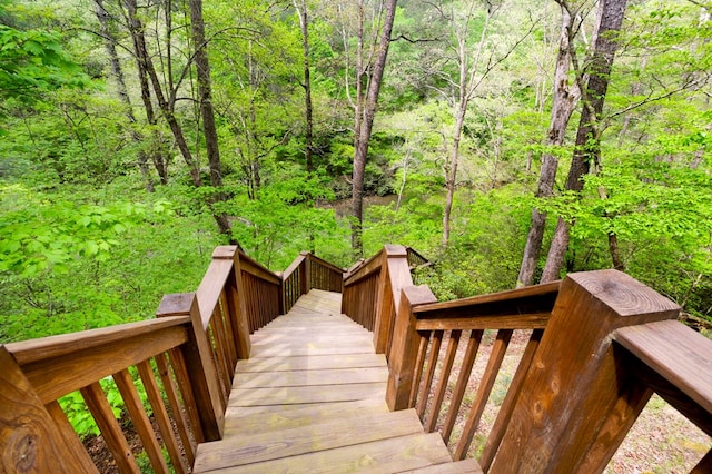 view of property's community with a forest view