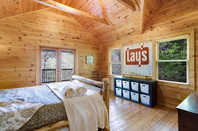 bedroom with access to outside, lofted ceiling with beams, wood-type flooring, wood walls, and wood ceiling