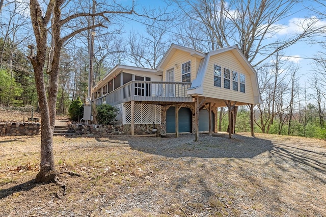 view of front of property featuring a wooden deck