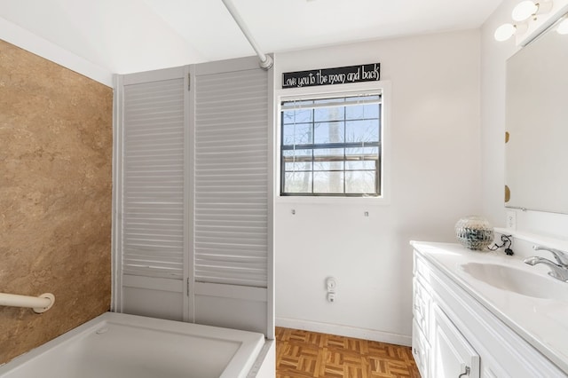 bathroom featuring vanity and parquet flooring