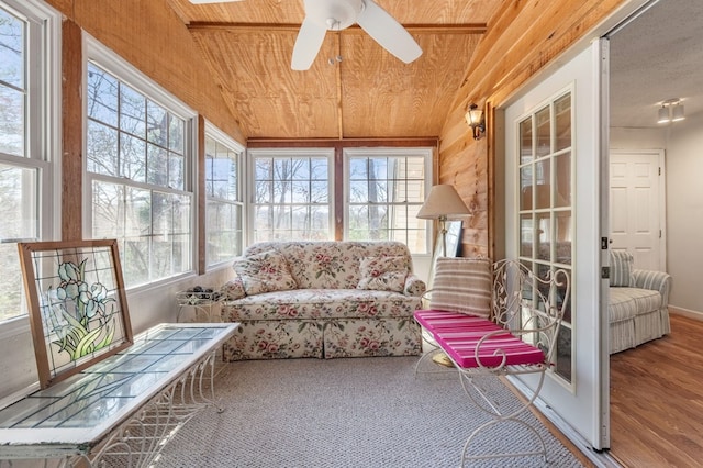 sunroom / solarium featuring wooden ceiling, vaulted ceiling, and ceiling fan