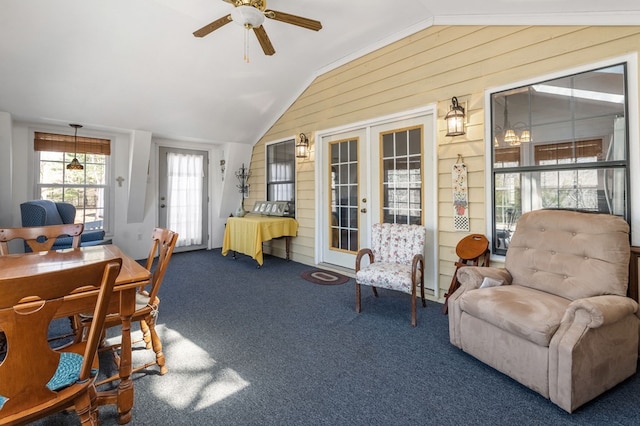 interior space featuring ceiling fan and lofted ceiling