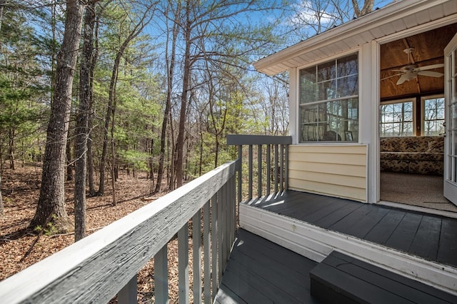 wooden terrace featuring ceiling fan