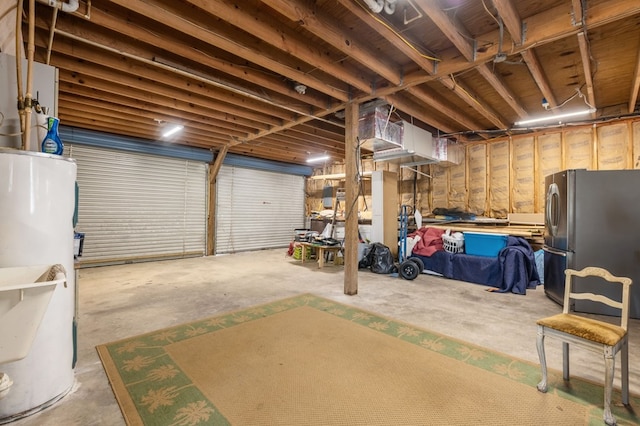 garage with stainless steel refrigerator