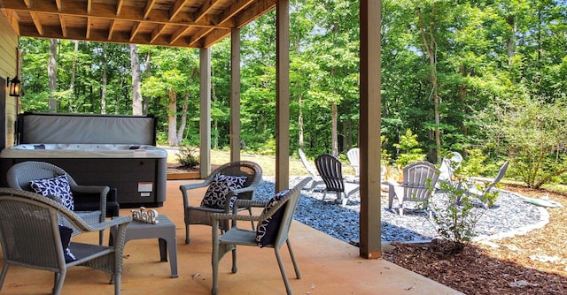 view of patio / terrace with a hot tub