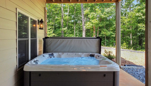 view of patio / terrace with a hot tub