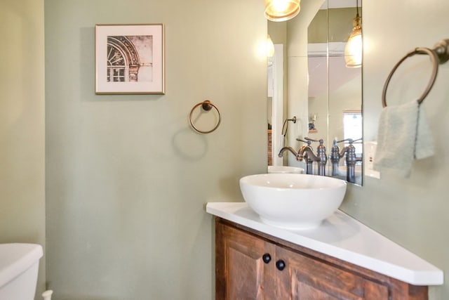 bathroom with vanity and toilet