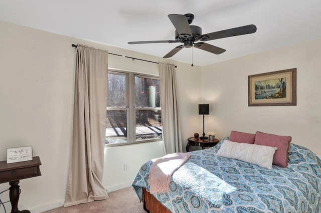 bedroom featuring ceiling fan and light colored carpet