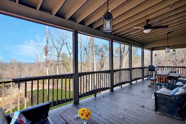 wooden terrace featuring ceiling fan