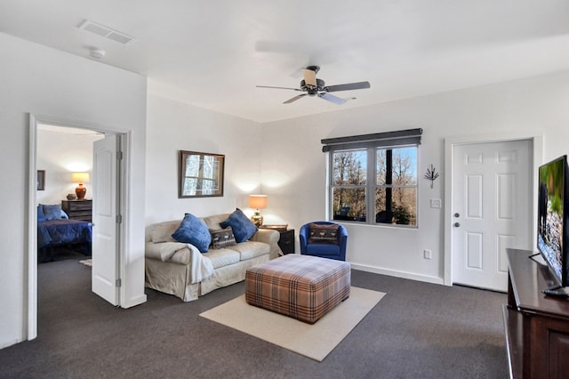 living room with dark carpet and ceiling fan