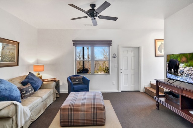 carpeted living room with ceiling fan