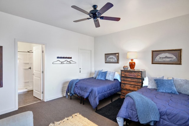 bedroom with dark colored carpet, ensuite bath, and ceiling fan