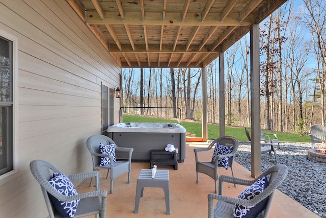 view of patio featuring a fire pit and a hot tub