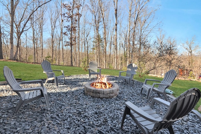 view of yard with an outdoor fire pit