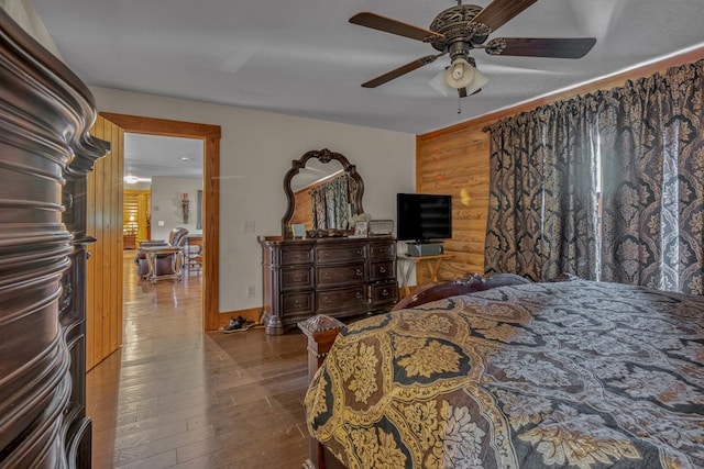 bedroom with ceiling fan and light wood-type flooring