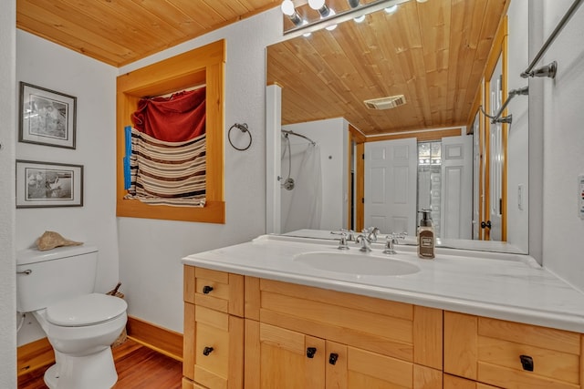 bathroom featuring vanity, wood-type flooring, wooden ceiling, and toilet