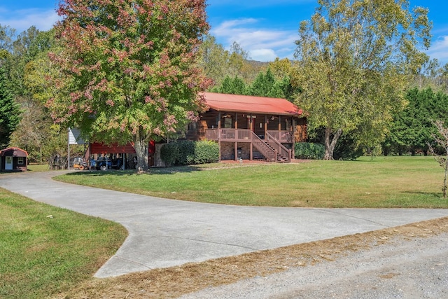 log home with a front lawn and a porch