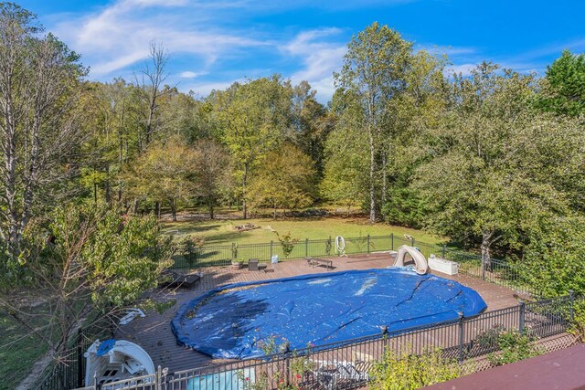 view of swimming pool featuring a water slide