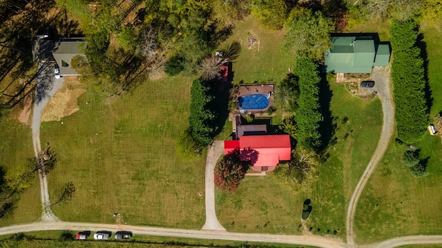 birds eye view of property with a rural view