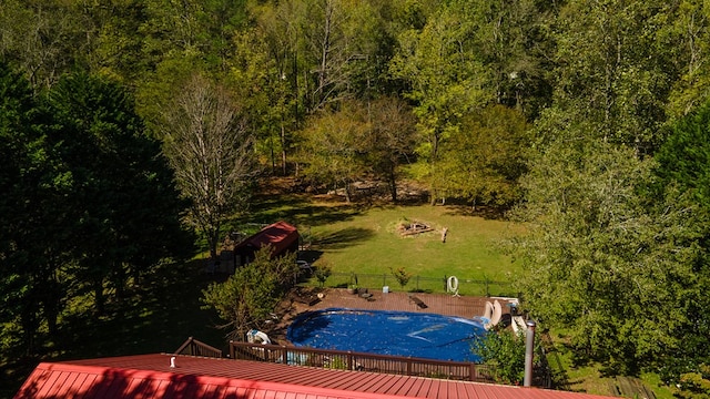 exterior space with a deck and a lawn