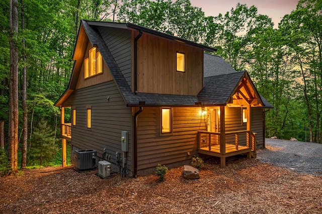 74 Cohutta Overlook Way, Blue Ridge, GA 30513 - view of front of property featuring roof with shingles, cooling unit, and view of scattered trees