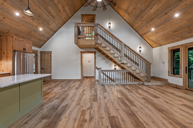 74 Cohutta Overlook Way, Blue Ridge, GA 30513 - unfurnished living room with wood ceiling, high vaulted ceiling, light wood finished floors, baseboards, and a ceiling fan