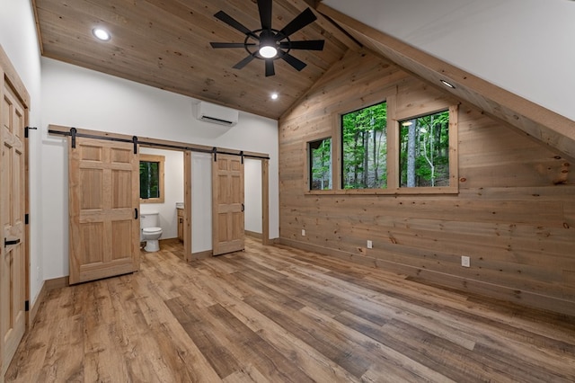 74 Cohutta Overlook Way, Blue Ridge, GA 30513 - unfurnished bedroom featuring a barn door, a wall unit AC, recessed lighting, light wood finished floors, and wood ceiling