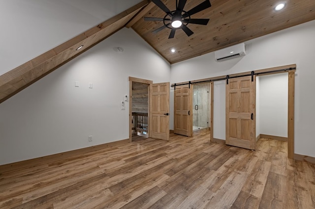 74 Cohutta Overlook Way, Blue Ridge, GA 30513 - unfurnished bedroom featuring a barn door, an AC wall unit, wood finished floors, recessed lighting, and beamed ceiling