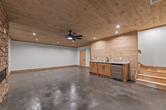 74 Cohutta Overlook Way, Blue Ridge, GA 30513 - indoor wet bar with finished concrete flooring, recessed lighting, a ceiling fan, a stone fireplace, and stairs