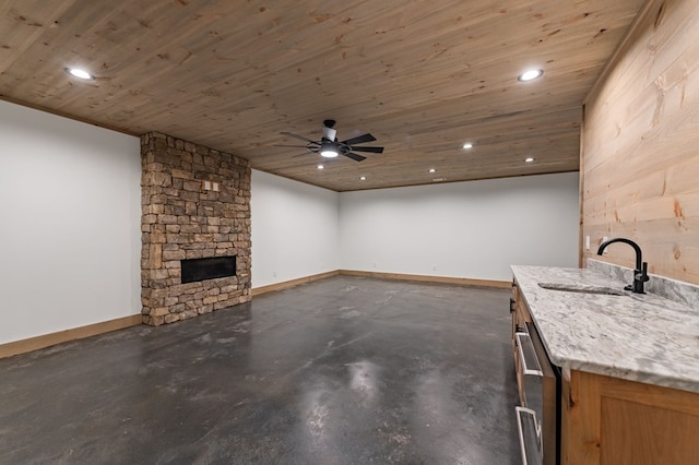 74 Cohutta Overlook Way, Blue Ridge, GA 30513 - unfurnished living room featuring a sink, recessed lighting, wooden ceiling, a stone fireplace, and baseboards