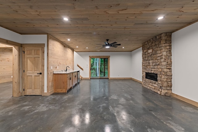 74 Cohutta Overlook Way, Blue Ridge, GA 30513 - unfurnished living room with concrete floors, a stone fireplace, wood ceiling, recessed lighting, and baseboards
