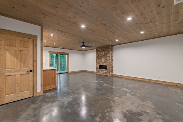 74 Cohutta Overlook Way, Blue Ridge, GA 30513 - unfurnished living room featuring concrete floors, recessed lighting, a ceiling fan, a fireplace, and baseboards