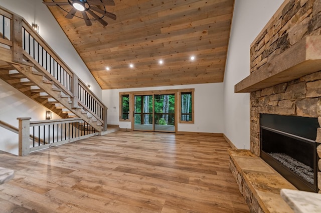 74 Cohutta Overlook Way, Blue Ridge, GA 30513 - unfurnished living room featuring a ceiling fan, wood finished floors, high vaulted ceiling, recessed lighting, and stairs
