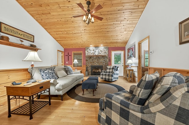 191 Deer Run Rd, Blairsville, GA 30512 - living area with vaulted ceiling, wood ceiling, wainscoting, a fireplace, and light wood-style flooring